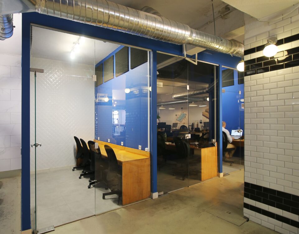 Private Offices at Virtual office Lisbon's space at night with chairs, computer an amazing office environment.